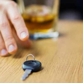 alcohol in glass reaching for keys | dui attorney